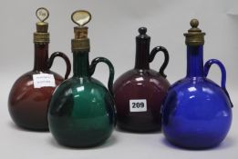 A pair of 19th Century blue glass decanters and another green glass decanter