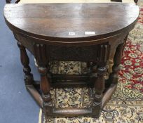 A 17th century style oak credence table, W.91cm