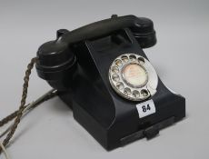 A black Bakelite telephone