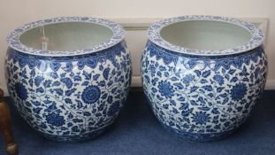 A pair of modern Chinese blue and white fish bowls