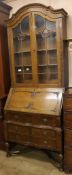 A reproduction oak bureau bookcase, H.222cm