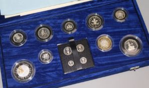 A cased Royal Mint Millennium silver collection 5p to £5 and maundy 1p-4p