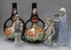 Three Lladro figures, a Nao figure and a pair of vases