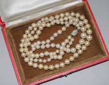 A double strand graduated cultured pearl clasp with French 18ct gold and cultured pearl set clasp,