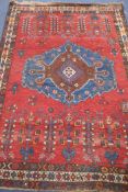 A Shirvan style red ground rug, 210cm x 156cm