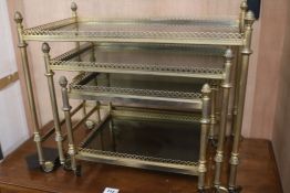 A nest of 3 glass and brass tables, W.61cm