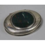 A late 18th/early 19th century silver oval snuff box, the lid inset with bloodstone panel, maker's