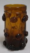 A Rheinish amber glass humpen, decorated with "raspberry prunts", 5.75in.