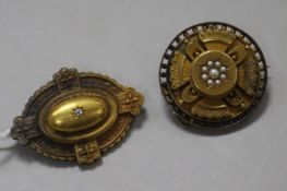 Two late Victorian 15ct gold and gem set brooches, with glazed backs, largest 4.5cm.