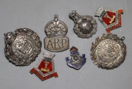 A small quantity of silver military badges