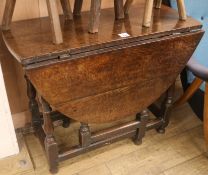 An 18th century oak gateleg table, W.94cm