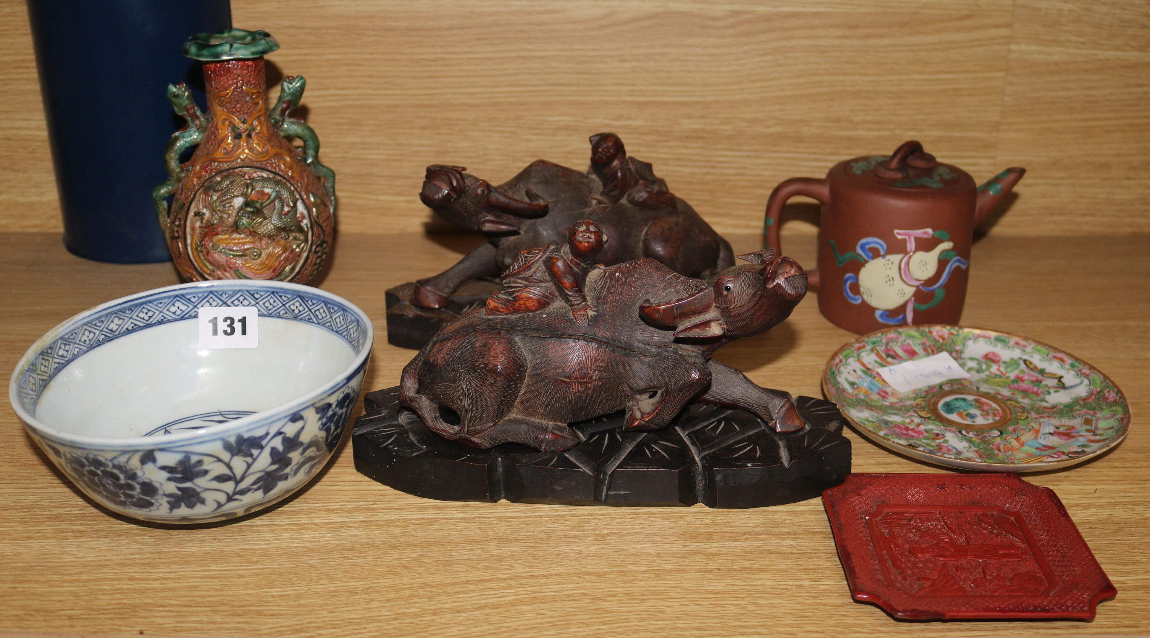 A carved buffalo vase, teapot etc.