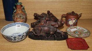 A carved buffalo vase, teapot etc.