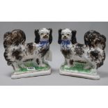 A pair of 20th century Staffordshire figure of Pekinese dogs
