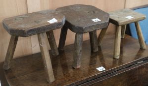 Three milking stools, W.31cm largest