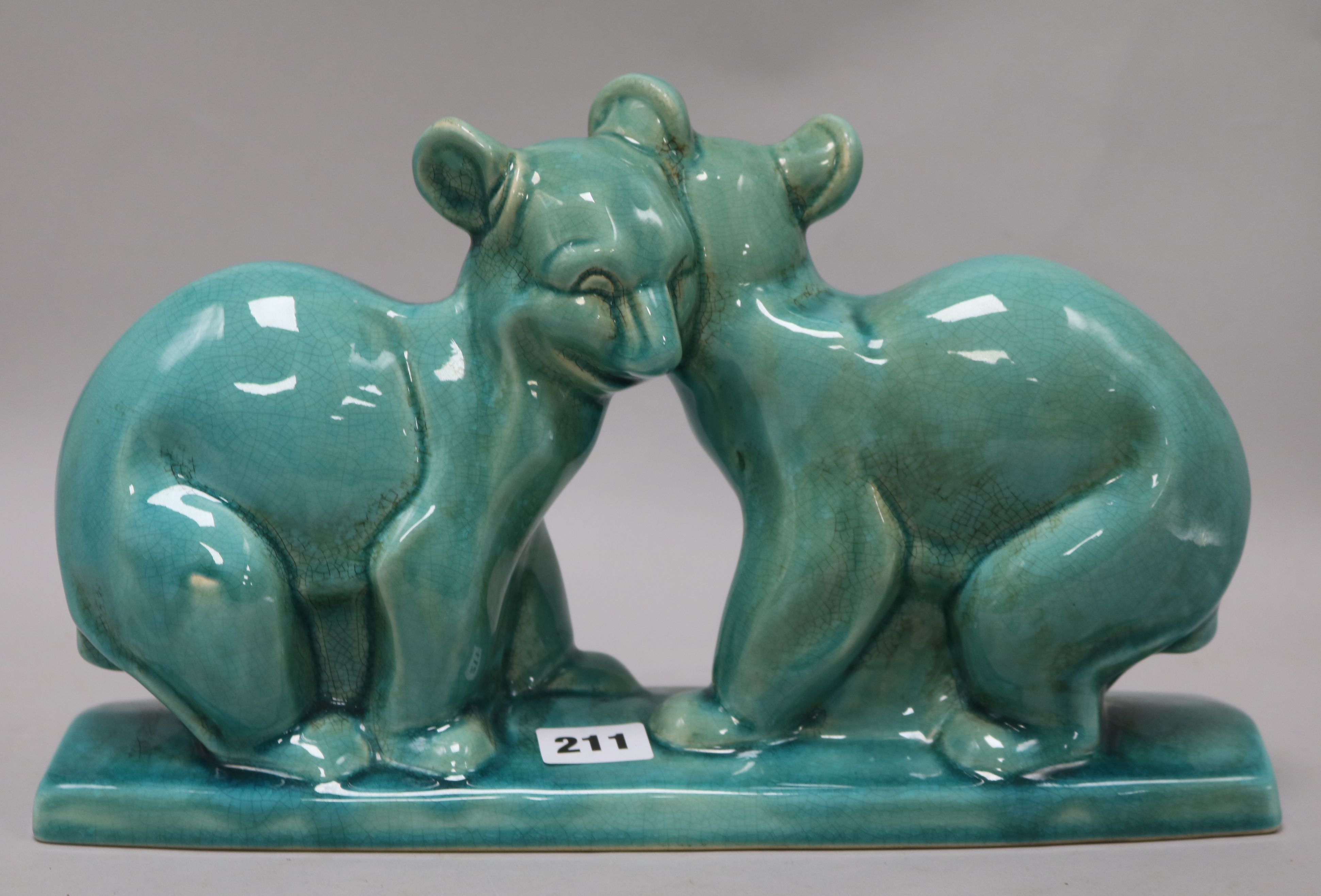 An Art Deco French turquoise glazed model of bears