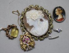 A cameo brooch, a fob, a silver brooch and two 9ct white gold pendants.