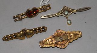 Three late 19th/ early 20th century 15ct gold and gem set bar brooches and a similar 9ct gold bar