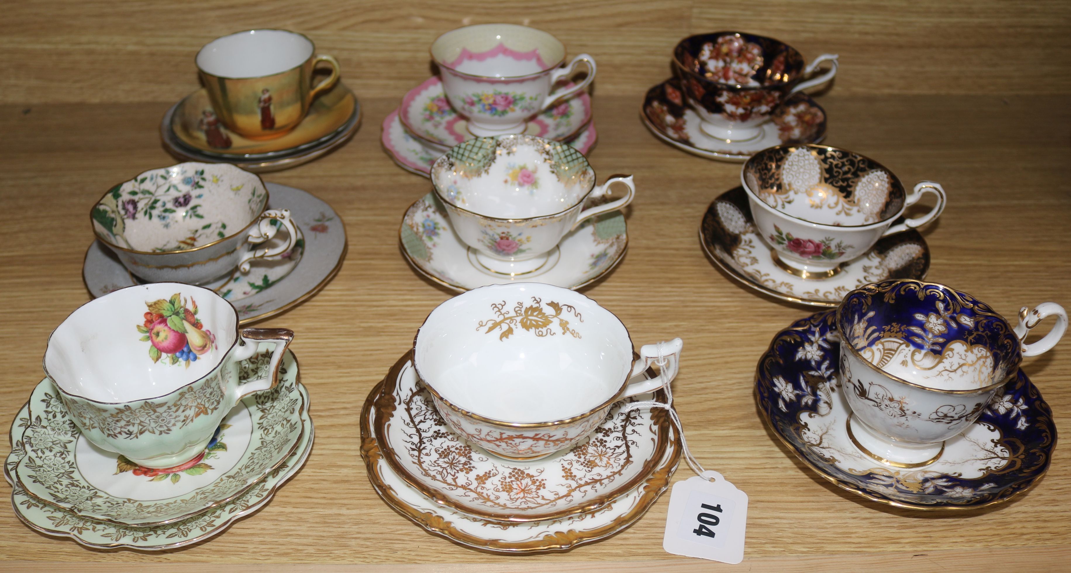 A quantity of mixed tea cups and saucers