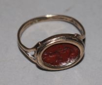 A Georgian gold and carnelian set signet ring, size J.