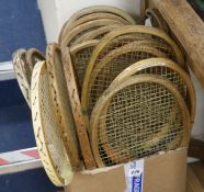 A collection of twenty old tennis racquets and seventeen presses