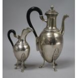 A 19th century Empire style silver coffee pot and cream jug, of ovoid classical form, each with