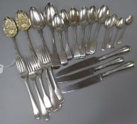 A pair of George III silver "berry" spoons and a quantity of silver flatware and three silver