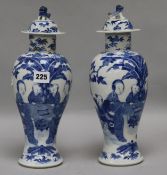 Two Chinese blue and white vases and covers
