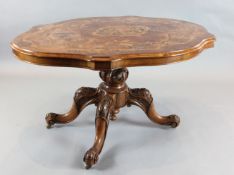A Victorian marquetry inlaid figured walnut serpentine breakfast table, with tilt top and foliate