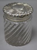A late Victorian repousse silver mounted glass biscuit barrel, by John Grinsell & Sons, London,