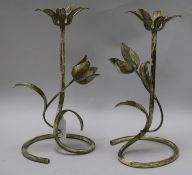 A pair of painted metal candlesticks