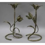 A pair of painted metal candlesticks