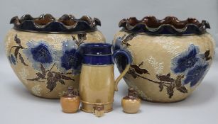 A pair of Doulton Lambeth stoneware jardinieres, three jugs and a tyg