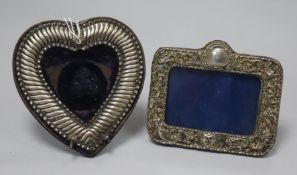 A late Victorian silver mounted pocket watch holder and a silver mounted photograph frame.
