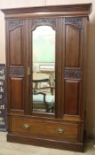 A late Victorian wardrobe with mirrored door, H.205cm