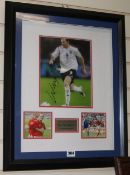 A signed Wayne Rooney photographCOA from Rye by Post, presentation framed.