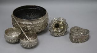 A Burmese? white metal bowl decorated with figures, two other bowls and three other items.
