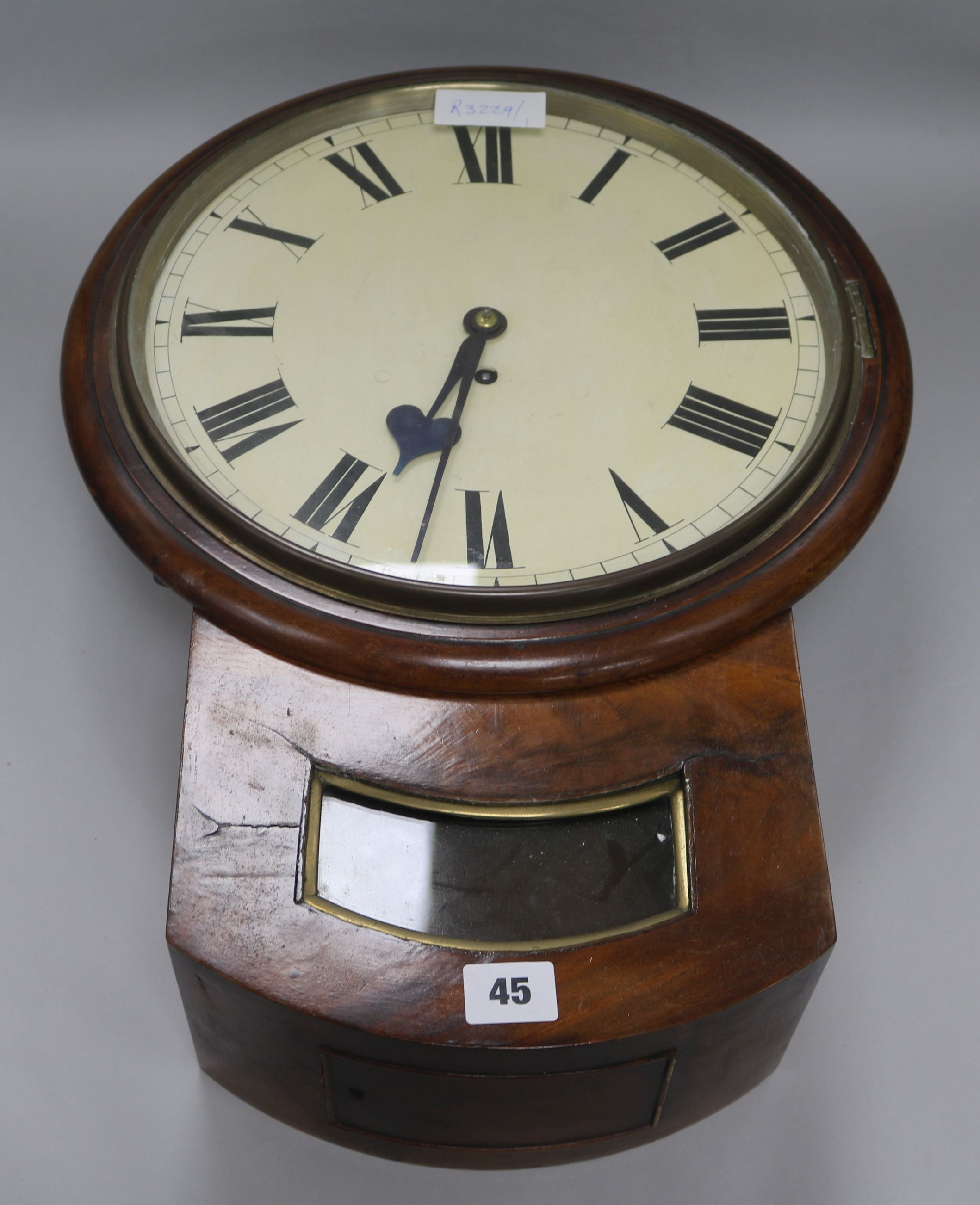 A mahogany wall clock