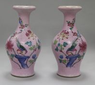 A pair of Chinese pink sgraffito ground famille rose vases