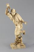 A Japanese ivory of a Samurai, Meiji period, standing amid scholar's objects and bent arrows,