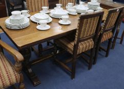 Oak refectory table on pineapple base supports and six chairs, W.183cm