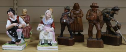 A pair of Staffordshire figures, a pair of Capodimonte figures and various carved wood figures (8)