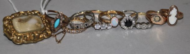 Nine assorted gold and gem set rings and a mourning brooch.