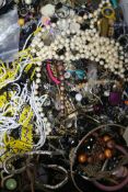 A box of mixed costume jewellery.