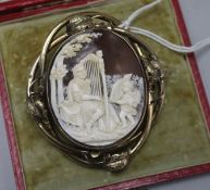 A cased Victorian 9ct gold mounted oval shell cameo brooch, depicting King David singing psalms,