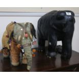 A large ebony elephant and Indian fabric elephant