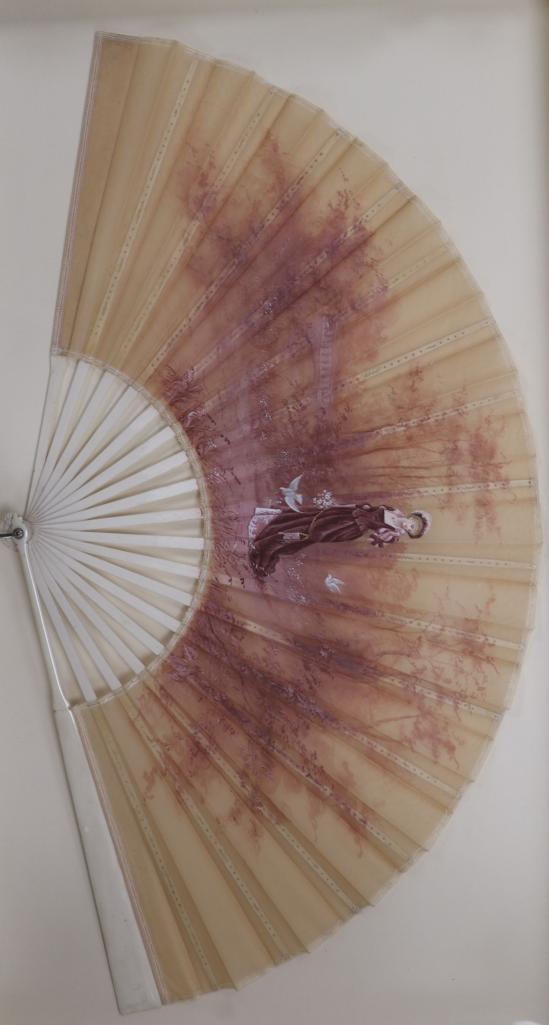 A framed handpainted fan