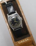 A lady's? mid 20th century stainless steel Omega manual wind wrist watch, with black dial, with