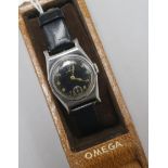 A lady's? mid 20th century stainless steel Omega manual wind wrist watch, with black dial, with