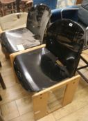 A pair of stylish modern black perspex chairs